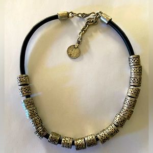 Silver necklace on leather band